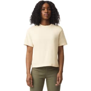 A cream-coloured heavyweight boxy T-shirt for women, featuring short sleeves and a simple design.