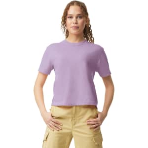A lavender women's heavyweight boxy T-shirt with short sleeves, displayed by a model in casual attire.