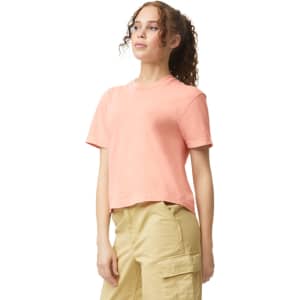 A women's heavyweight boxy t-shirt in a soft peach colour, featuring a casual fit and short sleeves.