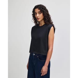 A grey muscle t-shirt with a cropped design, featuring shoulder cutouts and a plain logo.