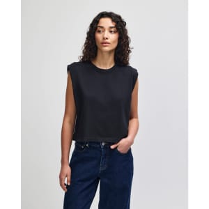 A dark grey women's muscle t-shirt featuring a relaxed fit and a branding logo.