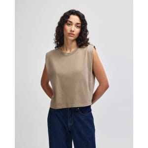 A women's muscle t-shirt in a muted olive green colour, featuring wide armholes and a casual fit. It includes a logo.