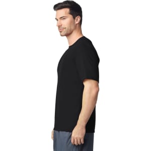 A black Gildan Performance adult T-shirt displayed on a male model from the side, featuring short sleeves.