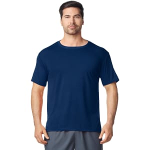 A navy Gildan Performance adult t-shirt displayed on a male model, featuring a round neckline and short sleeves.