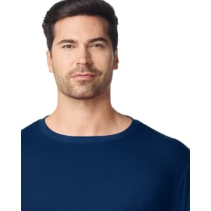 A navy Gildan Performance adult t-shirt worn by a man, featuring a crew neck and minimal branding.