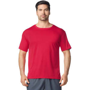 A red Gildan Performance adult t-shirt displayed on a male model, featuring short sleeves and a round neckline.
