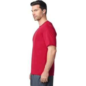 A red Gildan Performance adult T-shirt is shown on a model from the side, featuring a simple design and a logo.