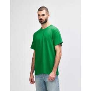 A green Gildan Heavy Cotton adult T-shirt displayed on a model against a plain background.