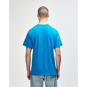 A blue Gildan Heavy Cotton Adult T-Shirt displayed from the back, featuring short sleeves and a logo.