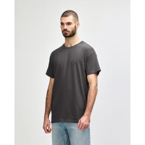 A light grey Gildan Heavy Cotton adult t-shirt displayed on a male model against a plain background.
