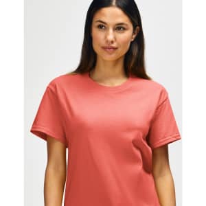 A coral Gildan Heavy Cotton Adult T-Shirt on a mannequin, featuring a round neckline and short sleeves.