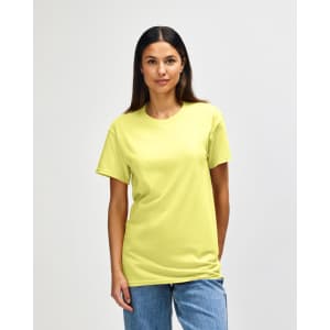 A yellow Gildan Heavy Cotton Adult T-Shirt is worn by a man standing against a plain background.