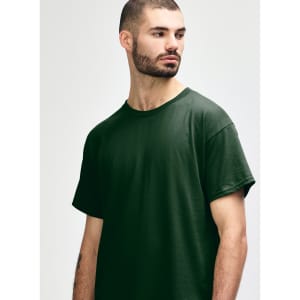 A dark green Gildan Heavy Cotton adult t-shirt with a crew neck and short sleeves. It features a logo.