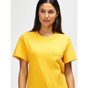 A yellow Gildan Heavy Cotton adult t-shirt displayed on a male model. The shirt has a simple design and a logo.