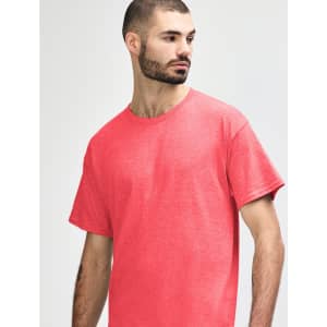 A red Gildan Heavy Cotton Adult T-Shirt on a model, featuring a simple design and a crew neck.