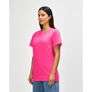 A pink Gildan Heavy Cotton Adult T-Shirt with a crew neck and short sleeves, displayed on a model.