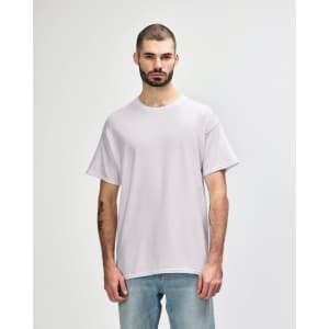 A light grey adult t-shirt displayed on a model, featuring a simple design and a branding logo.