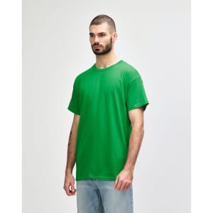 A model wearing a bright green Gildan Heavy Cotton adult T-shirt, standing against a plain background.