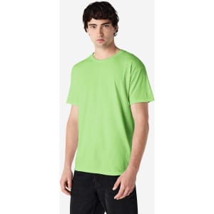 A man wearing a bright green Gildan Heavy Cotton Adult T-Shirt, with a blank design and a logo on the sleeve.