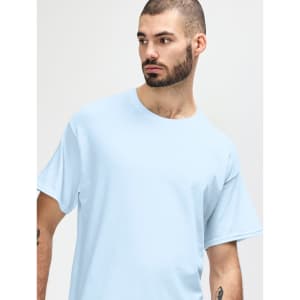 A light blue Gildan Heavy Cotton adult t-shirt is displayed on a model facing slightly to the side.