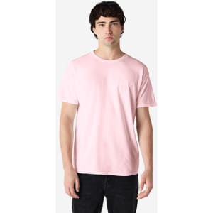 A pink Gildan Heavy Cotton Adult T-Shirt on a model, featuring a simple design and no visible logos.