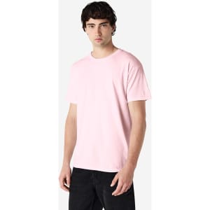 A pink Gildan Heavy Cotton Adult T-Shirt displayed on a model, featuring short sleeves and a relaxed fit.