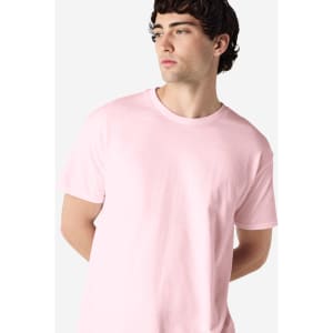 A light pink Gildan Heavy Cotton adult T-shirt with a crew neckline and a fitted style. It features a logo.