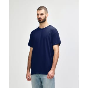 A navy adult T-shirt displayed on a model, featuring a basic design and a logo on the sleeve.