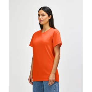 An orange Gildan Heavy Cotton adult T-shirt displayed on a male model. The shirt has a simple design and features a logo.