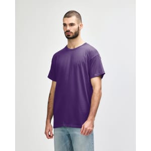 A purple Gildan Heavy Cotton adult T-shirt displayed on a model, featuring a blank design and no visible logos.