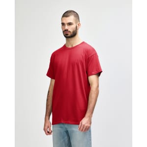 A red Gildan Heavy Cotton Adult T-Shirt displayed on a model, featuring a simple design and a logo.