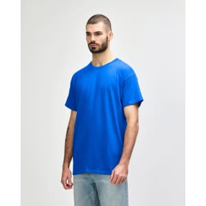 A blue Gildan Heavy Cotton Adult T-Shirt displayed on a model, featuring a brand logo.