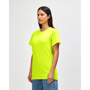 A bright yellow Gildan Heavy Cotton adult T-shirt worn by a model, featuring a logo on the front.