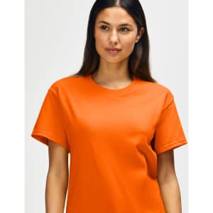 An orange Gildan Heavy Cotton adult T-shirt displayed on a model, featuring a classic fit and crew neckline.