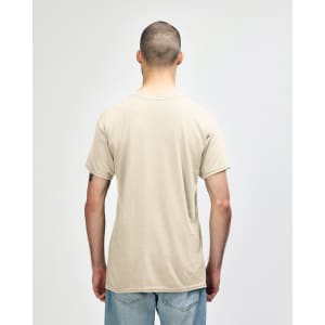 A beige Gildan Heavy Cotton adult T-shirt displayed from the back, featuring a simple design and short sleeves.