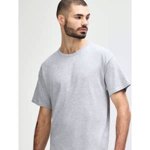 A grey Gildan Heavy Cotton Adult T-Shirt displayed on a model, featuring a simple design and a logo.