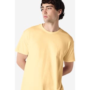 A yellow Gildan Heavy Cotton adult T-shirt, featuring a crew neck and a model displaying the side profile.