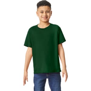 A green youth T-shirt is displayed on a smiling child, paired with denim jeans. The shirt has a logo.