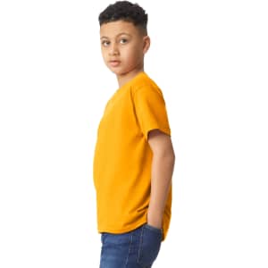 A youth t-shirt in vibrant orange, featuring a simple design and a logo on the front. The model poses sideways.