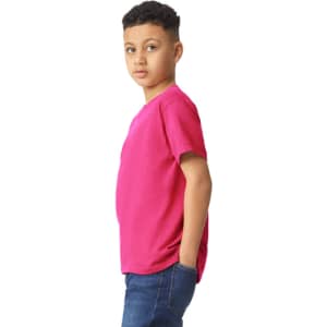 A youth T-shirt in vibrant pink, featuring a casual fit and short sleeves, displayed on a young model.
