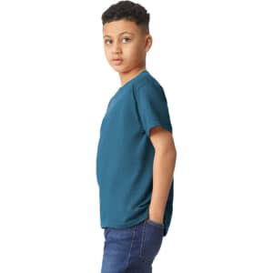 A youth t-shirt in teal, featuring short sleeves and a relaxed fit, displayed on a young model.