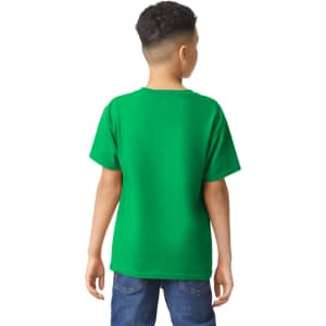 A green youth t-shirt with short sleeves, viewed from the back, worn by a child. It features a logo.