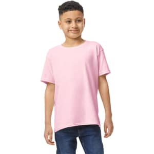 A youth t-shirt in light pink, featuring short sleeves and a relaxed fit, worn by a child. It has a logo visible.