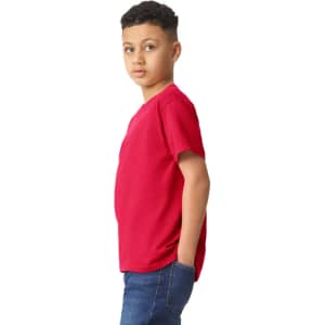A boy wearing a red Gildan Heavy Cotton Youth T-Shirt, featuring a simple design and casual fit.