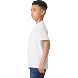A youth T-shirt in white, displayed on a model from the side, showing its relaxed fit and style.