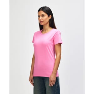 A pink Gildan Heavy Cotton ladies' T-shirt displayed on a model, showcasing a round neckline and short sleeves.