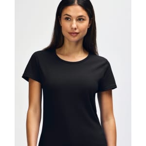 A black Gildan Heavy Cotton Ladies' T-Shirt displayed on a smiling woman, featuring a simple design and casual fit.