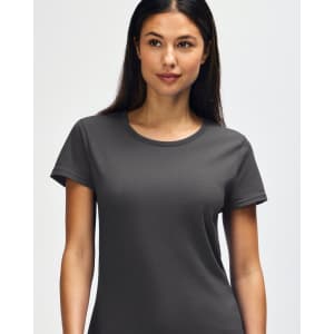 A grey Gildan Heavy Cotton Ladies' T-Shirt displayed on a smiling woman, featuring a simple design and soft fabric.