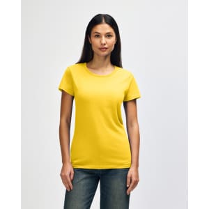 A yellow Gildan Heavy Cotton Ladies' T-Shirt displayed on a model with straight hair, paired with blue jeans.