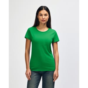 A green Gildan Heavy Cotton Ladies' T-Shirt displayed on a model wearing denim jeans. The shirt has a logo.